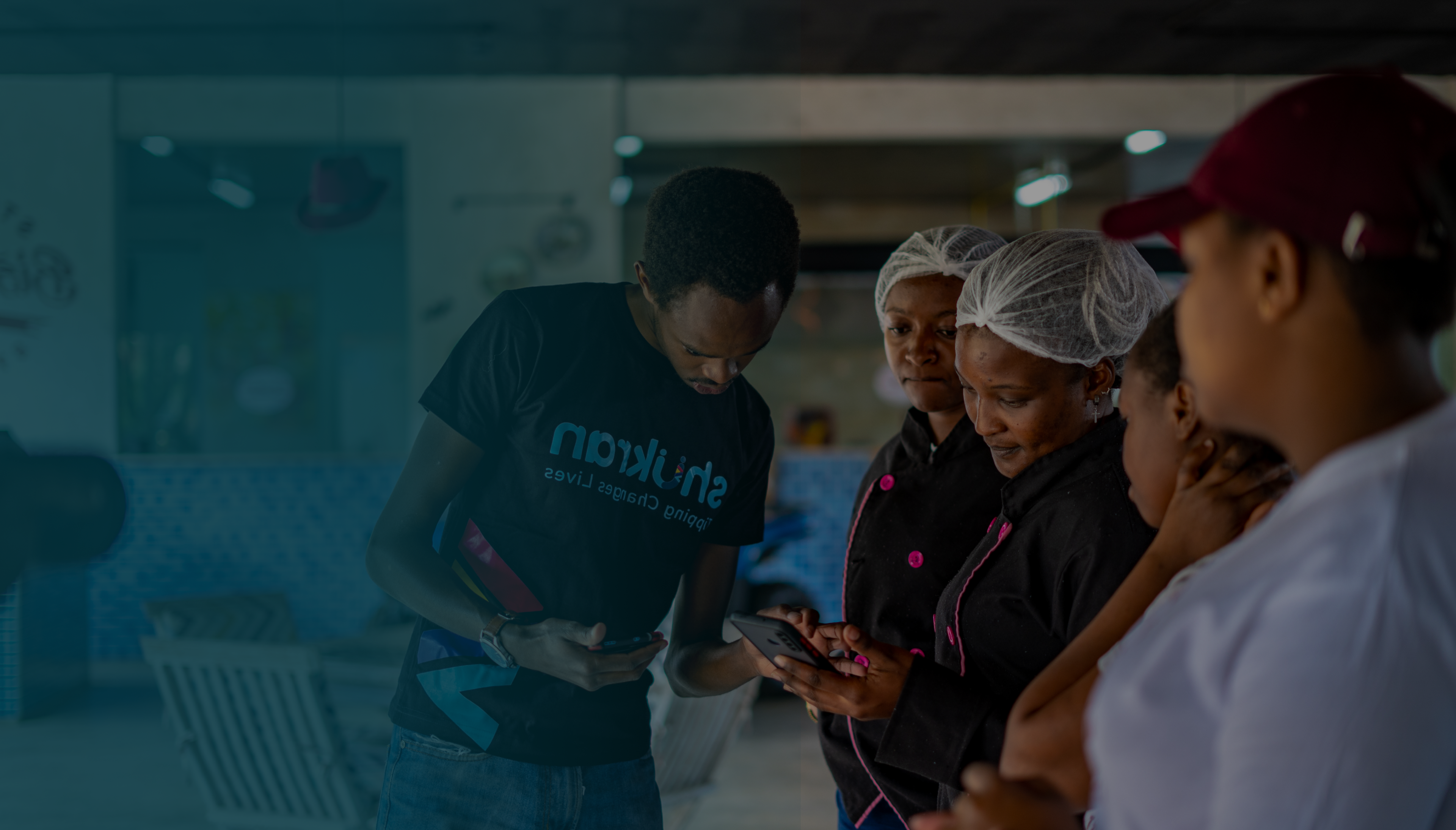 Restaurant staff looking at mobile device